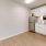 a kitchen with white cabinets