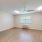a room with a wood floor and a ceiling fan