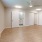 a room with white walls and a fan